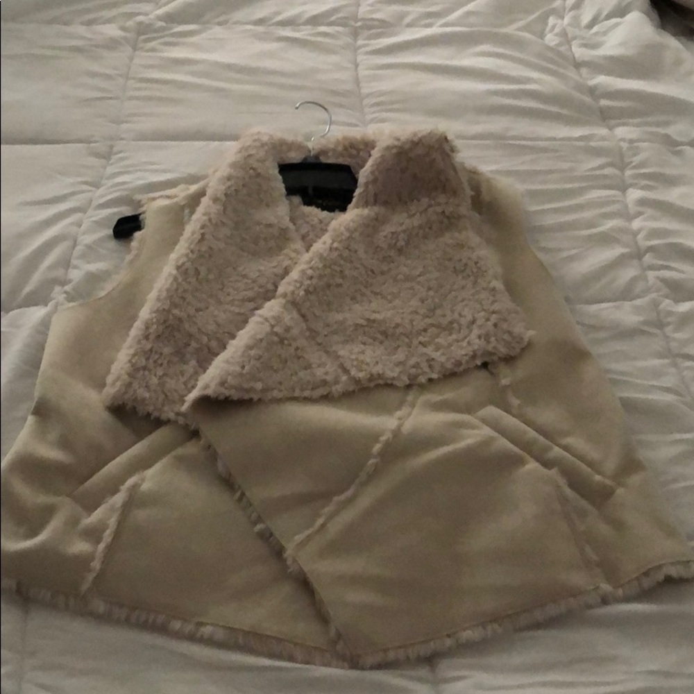 Women’s Vest. Faux fur inside and trim. Never worn